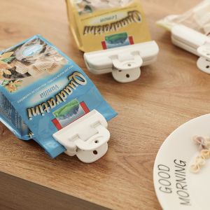 China Creative Custom Snack Sealing Bags Clip Multi Functional Food Storage Sealer Clip 2 Pcs Mini Plastic Bag Clip on sale