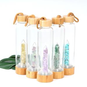 Wholesale Round Glass Water Bottle With Natural Crystal Gemstone Center Elixir Crystal Point from china suppliers