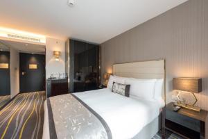 Wholesale Melaka light luxury hotel room design of guestroom furniture by Stainless steel leather headboard bed with fashion table from china suppliers
