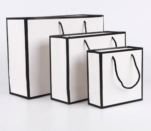 China Luxury Black White Paper Bag Gift Custom Printed Shopping Bag on sale