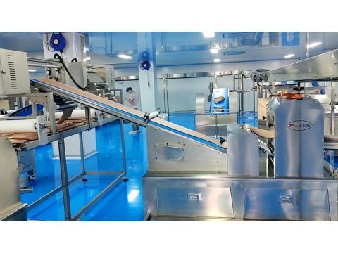 Twin-line stress-free dough laminating process optimizing crumb texture for rye and whole wheat toast.
