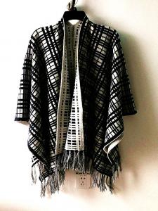 China Womens's fashion jacquard poncho with tassel long sleeve sweater Lady's plaid sweater on sale