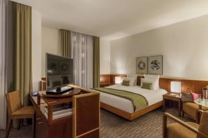 Wholesale Madagascar hotel bedroom furniture set of wood headboard bed with combine desk table and fabric cushion chairs from china suppliers