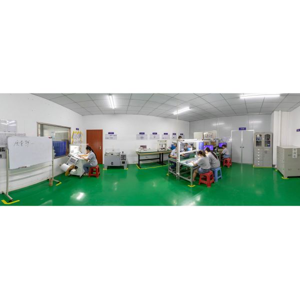 Mingcai Electronic's clean quality control laboratory for membrane switches with employees conducting performance testing