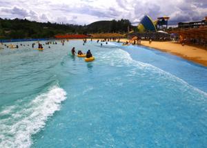 China Pneumatic Water Park Wave Pool 0.9-1.5 Wave Height With Artificial Sandy Beach on sale